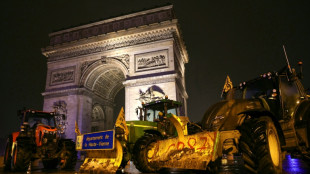 Farmers enter Paris on tractors to rage against trade deal