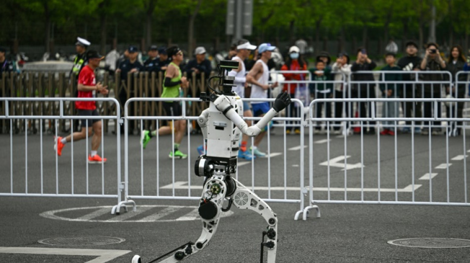 Humans far behind as robot breaks record at Beijing half marathon