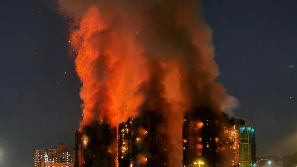 Fire engulfs Hong Kong residential blocks, killing at least 13